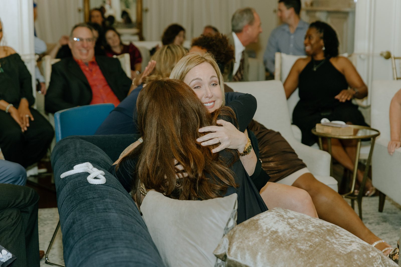 Two guests embracing after the show