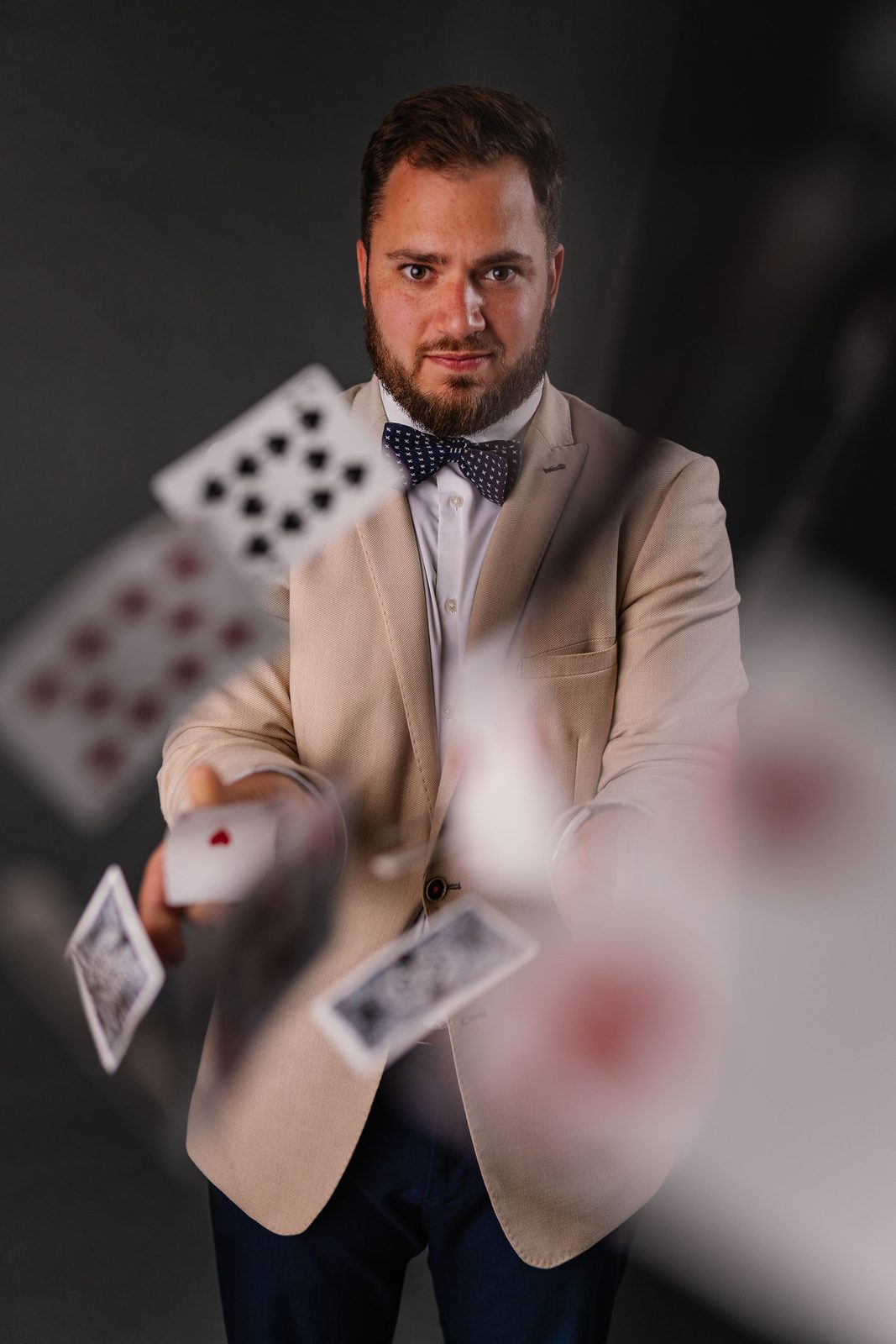 Aaron with cards in mid-air