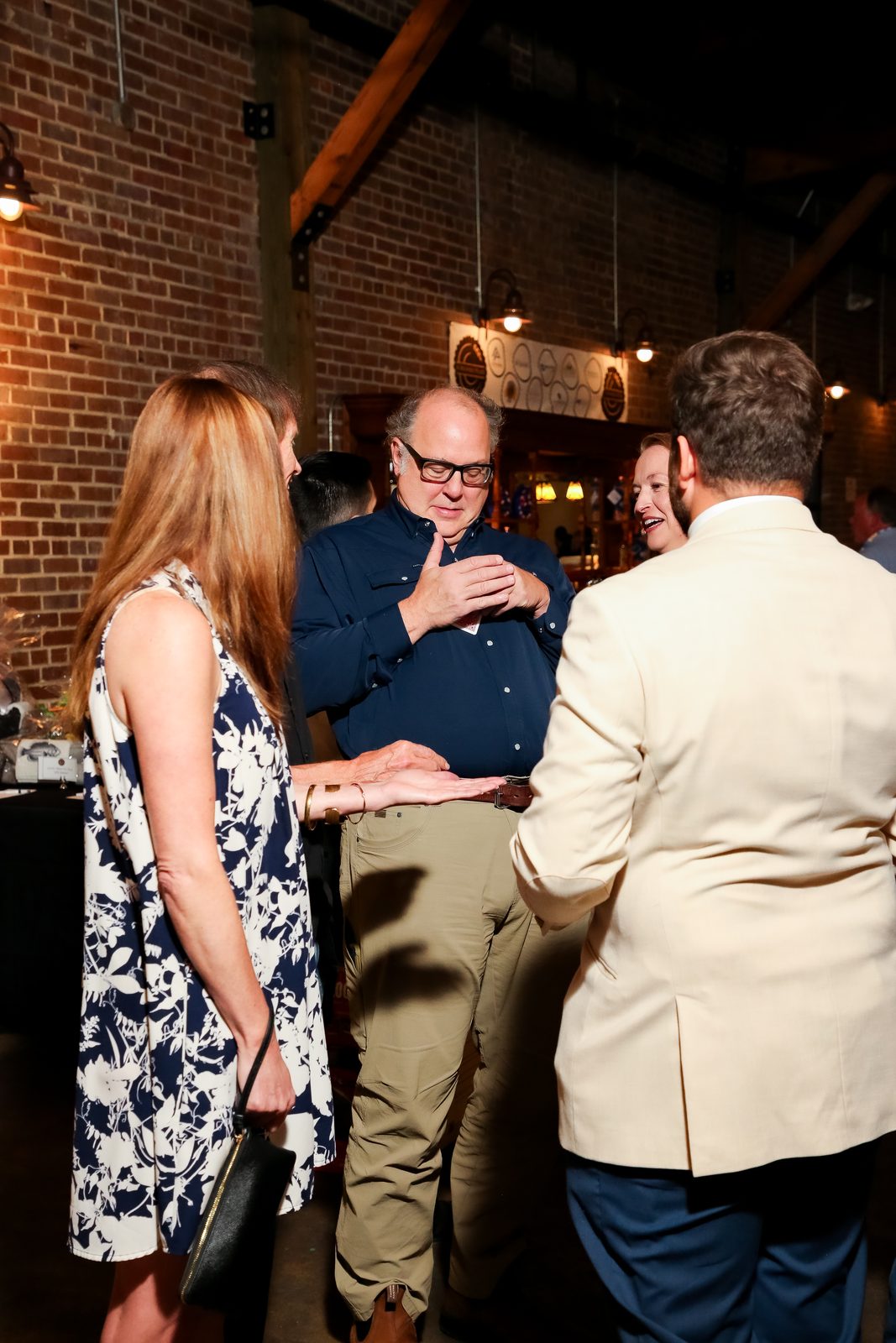 Aaron performing close-up magic for a small group